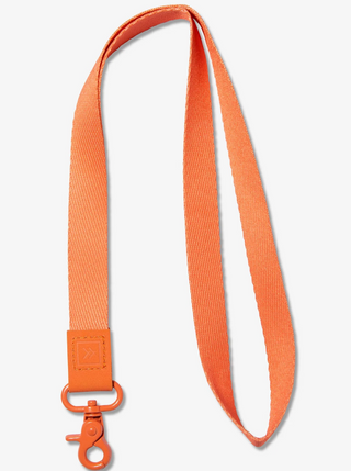 Apricot Neck Lanyard  Take on the world in style with our Neck Lanyard–the perfect sidekick to carry your keys, Thread® essentials, and more. Keep track of your stuff and express yourself with our convenient and cool lanyards.  • Polyester strap, genuine leather loop and metal clasp   • Quality Metal clasp  Length: 17 in (6.7 cm)  Width: ¾ in (2 cm)