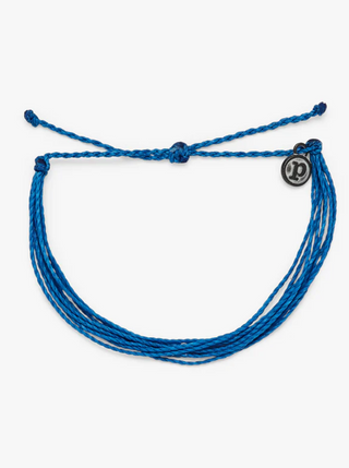 Pura Vida Bright Solid Bracelet in Royal Blue  It’s the bracelet that started it all. Each one is handmade, waterproof and totally unique—in fact, the more you wear it, the cooler it looks. Grab yours today to feel the Pura Vida vibes.  Brand: Pura Vida Material: Wax-Coated Size & Fit: Adjustable from 2-5 Inches in Diameter