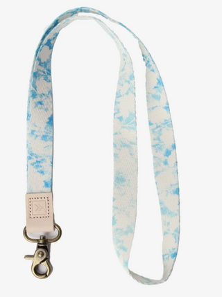 Lexie Neck Lanyard  Take on the world in style with our Neck Lanyard–the perfect sidekick to carry your keys, Thread® essentials, and more. Keep track of your stuff and express yourself with our convenient and cool lanyards.  • Polyester strap, genuine leather loop and metal clasp   • Quality Metal clasp  Length: 17 in (6.7 cm)  Width: ¾ in (2 cm)