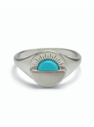 Watch the sun go down in style with our Gemstone Sunset Signet Ring. Silver coin design stamped with a simple sunset graphic. Each ring is accented with a genuine turquoise stone for a pretty pop of color.