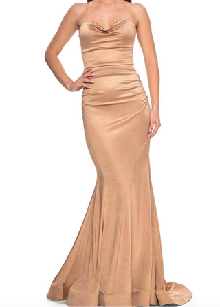 Beige strapless gown on a white background