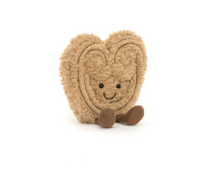 Heart-shaped plush toy with a smiling face on a white background, branded 'Amuseables Philippe Palmier'.