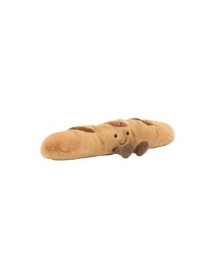 Plush baguette toy with a face on a white background, featuring the Jellycat logo.