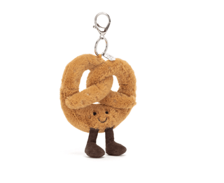 Plush pretzel-shaped keychain with a smiling face on a white background