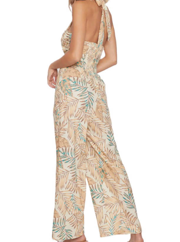 Anafi Palm Jumpsuit  This Anafi Palm Jumpsuit is the perfect blend of style and comfort. Constructed of a breathable linen blend, it features a tropical print, halter top detail, and wide leg pants. The bust offers a shirring bust panel with keyhole center detail. Smocking in the back and an adjustable tie at the neck finish off this daring look. Enjoy the perfect balance of fashion and function with this jumpsuit. back
