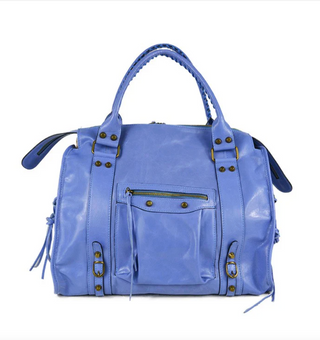 Blue handbag with gold accents on a white background