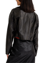 A faux leather cropped moto jacket with silver hardware is a fashion-forward and versatile wardrobe staple that combines edgy design elements with the durability and sustainability of faux leather. It's a statement piece that can elevate your style and add a touch of rebellion to your outfit choices.(back)