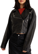 A faux leather cropped moto jacket with silver hardware is a fashion-forward and versatile wardrobe staple that combines edgy design elements with the durability and sustainability of faux leather. It's a statement piece that can elevate your style and add a touch of rebellion to your outfit choices.(front)