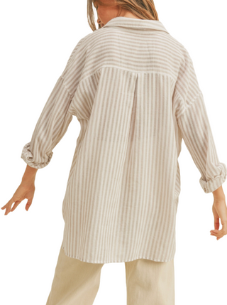 Breezy Days Button Down Shirt  A comfy and breezy tan and white striped button-down shirt. It's got a relaxed vibe with long sleeves and a couple of handy front pockets. Perfect for laid-back days and effortlessly stylish outings  Material:  100% Cotton back