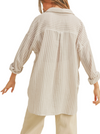Breezy Days Button Down Shirt  A comfy and breezy tan and white striped button-down shirt. It's got a relaxed vibe with long sleeves and a couple of handy front pockets. Perfect for laid-back days and effortlessly stylish outings  Material:  100% Cotton back