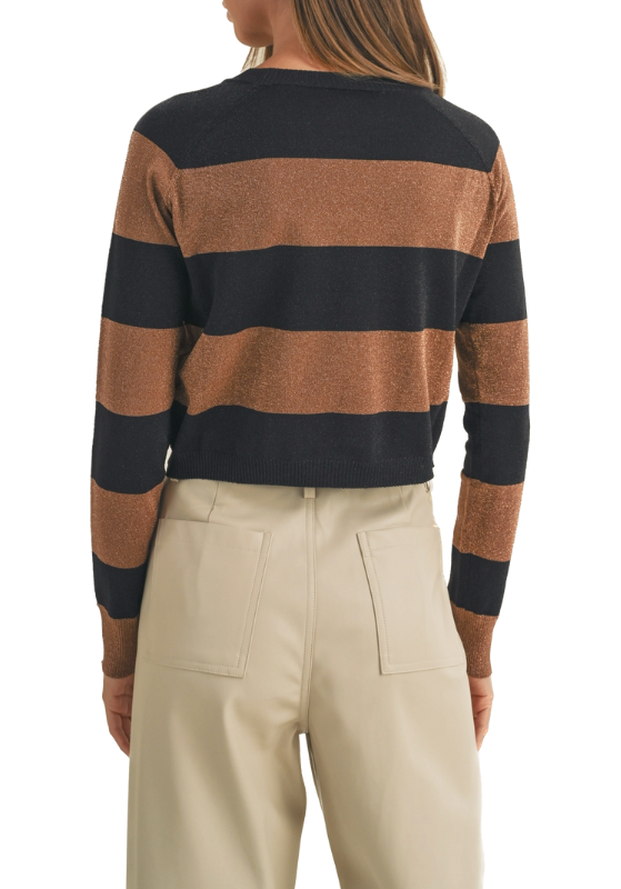 The brown and black striped sweater with shimmer detail is a stylish and versatile addition to your wardrobe. Its classic stripes and subtle shimmer detail make it a standout piece that can be dressed up or down, ensuring you look both elegant and comfortable in any setting.(back)