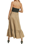 This strapless half-black, half-brown dress with a dimensional bow across the chest and a ruffle on the bottom is a fashion-forward and elegant choice. Its creative design elements, color contrast, and attention to detail make it a standout dress for those who want to make a sophisticated yet artistic statement at any event.(back)