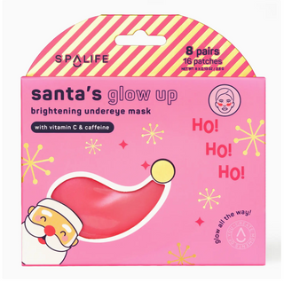 Spalife Santa's Glow Up brightening undereye mask packaging, featuring a pink box with a red and yellow striped top flap, a Santa hat illustration, and holiday-themed text and snowflake graphics.