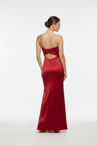 woman in a red formal gown with a back cut out long gown