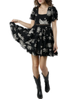 Emily Dress is a black and white dress featuring a tie back and puff sleeve detail.  100% Rayon