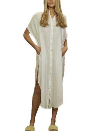Emily White Button Dress  Emily White Button Dress features a relaxed-fit maxi shirt dress with a dropped shoulder construction and a round-hemmed side slit.  Material 100% Cotton