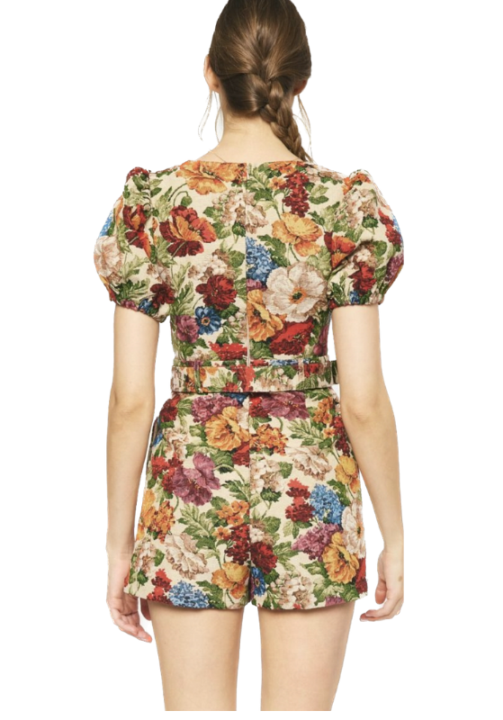 Falling For You Floral Romper is a floral print, puff sleeve, square neck romper featuring pockets at side. Belted waist. Zipper closure at back. Unlined.   Back View. 70% Polyester 30% Cotton