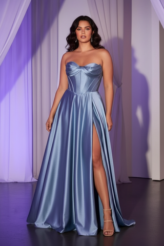 woman in a dusty blue dress tht is a formal gown to the floor with a slit over one leg.  and it is strapless