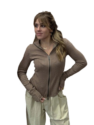 Woman standing in front of a white background