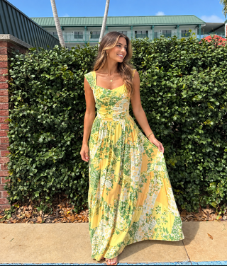 woman in yellow floral dress