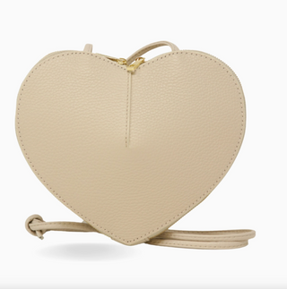 Heart-shaped beige handbag on a white background
