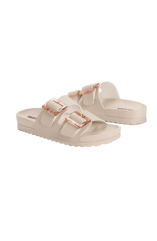 Beige sandals with rose gold buckles on a white background, featuring the Muk Luks brand.