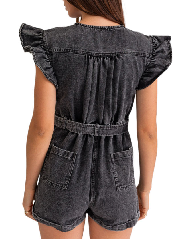 Grayscale Ruffle Denim Romper  Washed black denim button down romper with ruffle sleeve cap, front and back pockets and belted waist.  Material:  92% Cotton 8% Polyester back