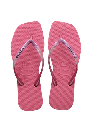 Havaianas Slim Square Glitter Sandal in Velvet Rose  Make a true fashion statement wherever you go in the Slim Square Sandal.  Featuring new and improved glitter that reflects light even more than before, these flip flops will give a special shimmer to every single step you take.  They're sure to instantly elevate any look!