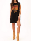 Head Out West Dress  Best dressed in all of the west.  The Head Out West Dress features a soft jersey fabric that drapes in all the right places, muscle tank silhouette, and mid-thigh length. The intentionally distressed graphic is a nod to a vintage find with colors inspired by the dusk of fall. Wear on its own paired with booties or layer underneath a leather jacket for a casually edgy look.