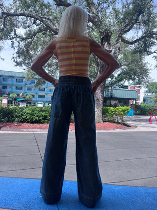 a woman wearing We The Free Breezy Denim Pull On Jean