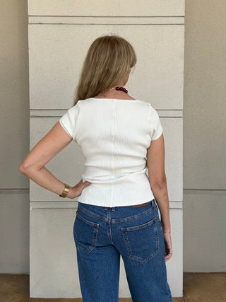 A woman wearing Free People Most Wanted Cardi in Ivory