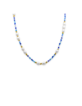 A beaded necklace with white baroque pearls and blue beads separated by small gold spacer beads, displayed on a clean white background.