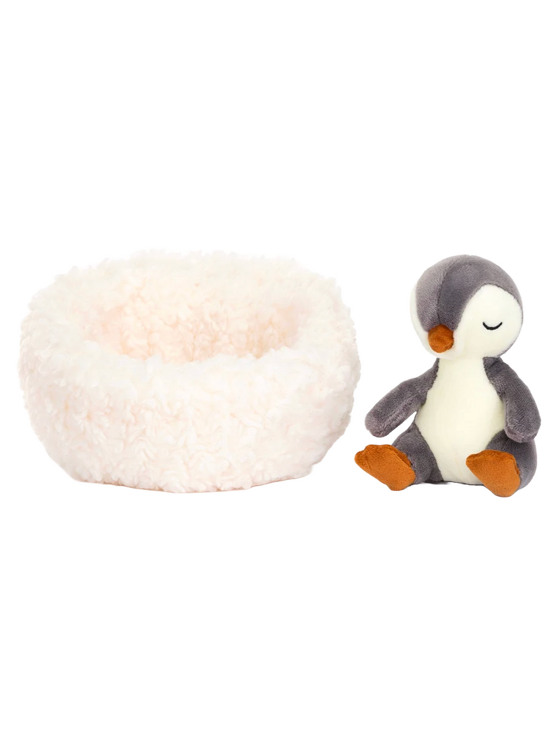 Jellycat Hibernating Penguin Snowman  Penguins don't normally sleep in the winter, but Hibernating Penguin does things their own way! This dreamy chick has made a fluffy fleece nest, perfect for dreaming the blizzards away. With warm-grey patches, a buttercream tum, suedey orange feet and a tiny tail, this snoozer knows how to keep cosy!  Brand: Jellycat Material: Polyester 