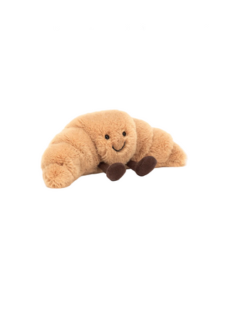 Plush toy croissant on a white background 