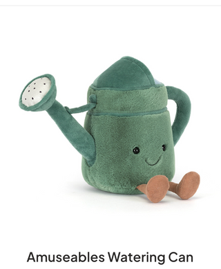 Plush watering can toy with a smiling face on a white background