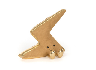 Gold lightning bolt-shaped figurine with a smiling face on a white background