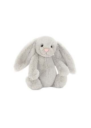 Gray plush bunny toy on a white background with Jellycat branding.