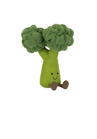 Toy broccoli with a smiling face on a white background