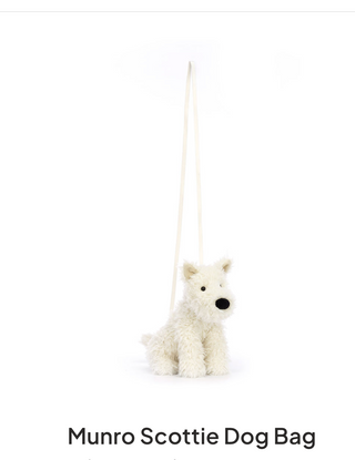 White dog-shaped bag with a handle on a white background, labeled 'Munro Scottie Dog Bag'.