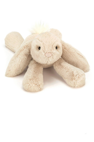 Beige plush bunny toy on a white background