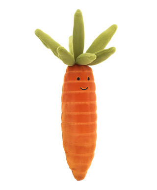 Plush carrot toy with a smiling face on a white background