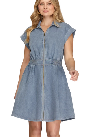 a woman wearing a Light Blue Denim Mini Dress with a front zipper