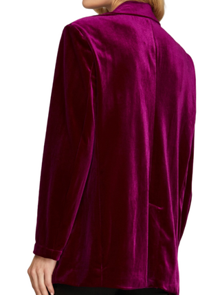 Magenta Velvet Chic Blazer  This single-button velvet blazer in magenta is a luxurious and vibrant addition to your wardrobe. Crafted from soft, plush velvet fabric, it exudes elegance and style. The single-button closure adds a sophisticated touch, making it perfect for dressing up your outfit with a bold pop of color. back