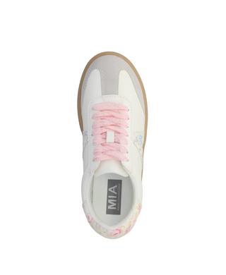 White sneaker with pink laces on a white background