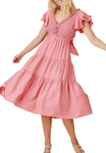 a pink smocked ruffle back cut-out tiered dress is a delightful and stylish choice for those who appreciate intricate details, a touch of romance, and a bohemian-inspired look. It's perfect for embracing the carefree spirit of summer and adding a touch of whimsy to your wardrobe.