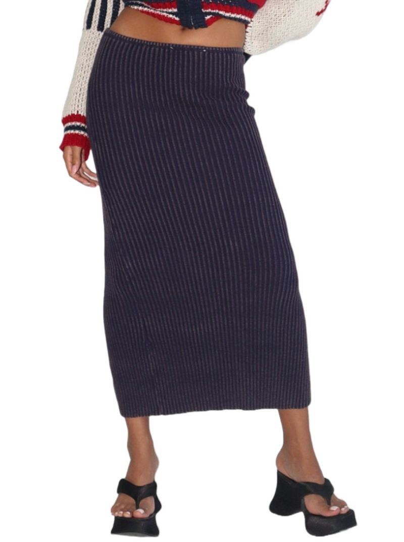 Nautical Nights Ribbed Maxi Skirt  A versatile ribbed knit maxi skirt in a rich garment-washed navy hue. Its classic design features a stylish back slit, offering both elegance and comfort for versatile, timeless fashion.   Material: 90% Cotton, 40% Polyester