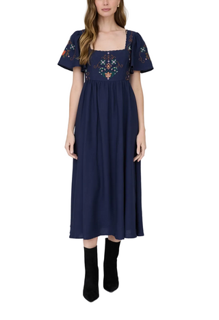 woman wearing a Navy Embroidered Midi Dress