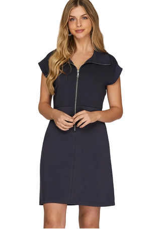 a woman wearing a mini Navy Scuba Dress