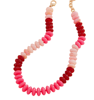 Necklace with pink and red beaded design on a white background