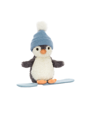 Plush penguin snowboarding toy with a blue hat on a white background
